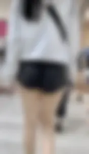 Asian girl in tight black shorts at the mall