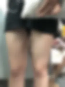 Girl in Black Shorts with Hot Legs Standing in the Subway Train Closeup