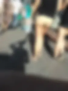 Brunette ass cheeks in short yellow shorts