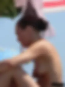 Sexy girls going topless at the beach showing off their sexy bodies