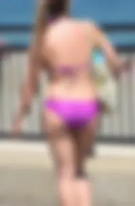 Sexy thick blonde girl in purple bikini