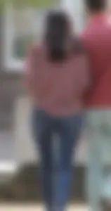 Brunette walking with her boyfriend in tight jeans