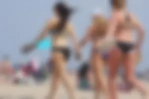3 sexy girls with nice asses walking on the beach in bikinis
