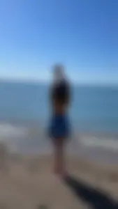 Milf in a skirt at the beach