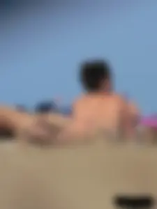 Sexy babe with a nice body topless and in a thong on the beach