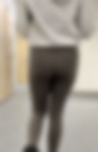 Following the blonde with Fake lashes in green leggings