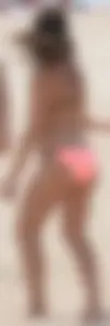 Girl in peach bikini on the beach with a great body and great ass
