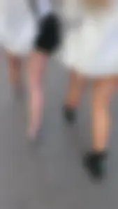 Street girlfriends in short dresses