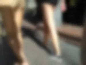 Brunette ass cheeks in short yellow shorts