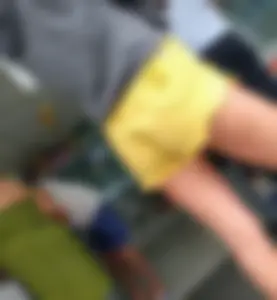 Skinny ass eating her yellow shorts