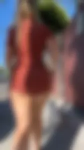 Summer blond in orange showing cheeks