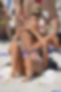 Sexy beach babe in pink bikini makes it a string bikini