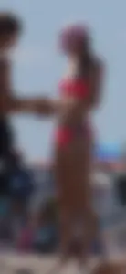 Sexy and skinny girl on the beach in pink bikini