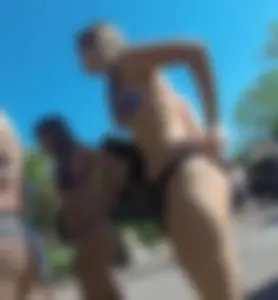 Two nice asses in thong bikinis at a Disney waterpark