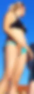 Blonde milf at the pool in small blue bikini