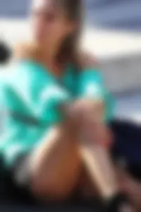 Blonde lady upskirted showing her panties and pussy lips