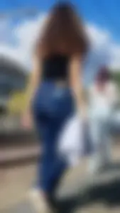 Hot butt in blue jeans at the train station