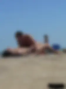Purple thong topless lady on the beach gets oiled up by her husband