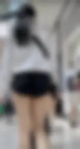 Asian girl in tight black shorts at the mall