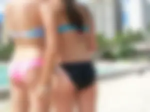 Sexy friends on vacation in pink and black bikinis with decent asses
