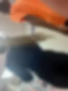 College teen wearing tight pants walking down the hall