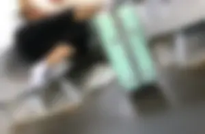 Hot Girlfriend in Pants And White, Slightly Dirty Socks, Her Sneakers Taken Off, Chilling on the Train Seat With Her Head on Her Boyfriend's Lap