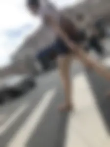 Young Girl in Shorts And Sandals Crossing the Street Gallery
