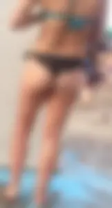 Beach shower milf in semi thong bikini with a nice ass