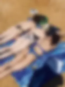 Group of candid girls with pale skin in swimsuits chilling on the beach creepshot