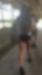 Brunette babes cheeks in tiny shorts walking
