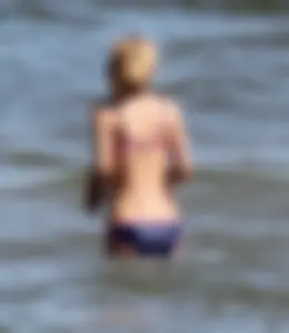 Two sexy beach teens in bikinis, one thick and one skinny with big boobs