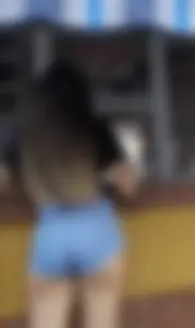 Gorgeous candid teen's booty in denim mini shorts showing cheek, a creepshot by a small street shop