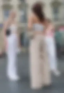 Long blonde braless in a white outfit (many pictures)