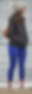 Cute girl with a nice ass in tight blue leggings along the water in San Fran