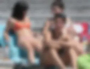 Bunch of sexy babes at the beach in bikinis