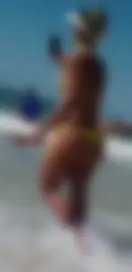 Big booty white chick in a yellow thong at the beach
