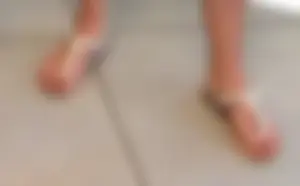 Teen feet in sandals closeup