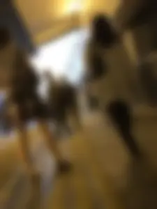 Cute Teen in Shorts on the Tram Stop