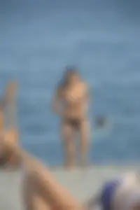 Sexy skinny babe in thong bikini on the beach