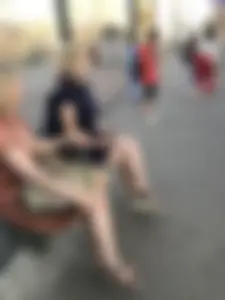 Very cute teen candid girl in a dress sitting on a bus stop creepshots