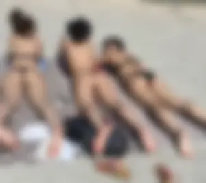 Large collection of hot beach girls lying on the beach and bending over