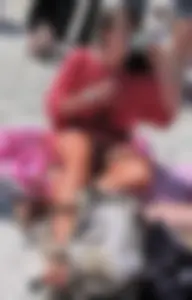 Brunette in pink skirt upskirted showing her white panties