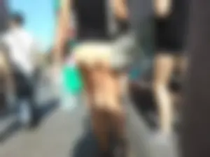 Brunette ass cheeks in short yellow shorts