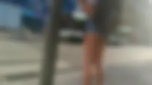 Girl walking in denim shorts showing some of her ass cheeks