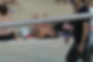 Topless girls on a beach in Barcelona