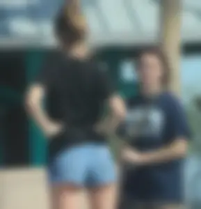 Candid skinny college girl in denim shorts showing some cheeks