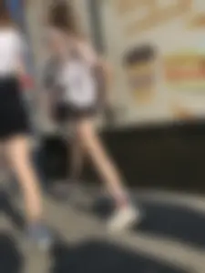 Couple of Skinny Girls in Mini-Skirts And Sneakers Street Photos