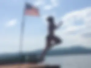 Girl in Swimsuit Jumping into the Water