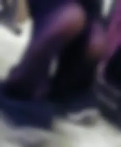 College girls' feet under table