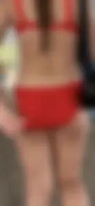 Beauty picks at her bikini wedgie